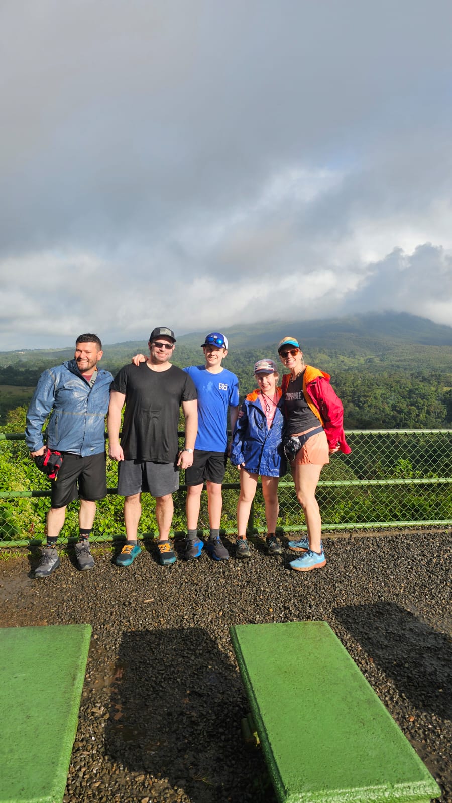 Michael with a family of guests at a misty overlook during a private EcoRide tour