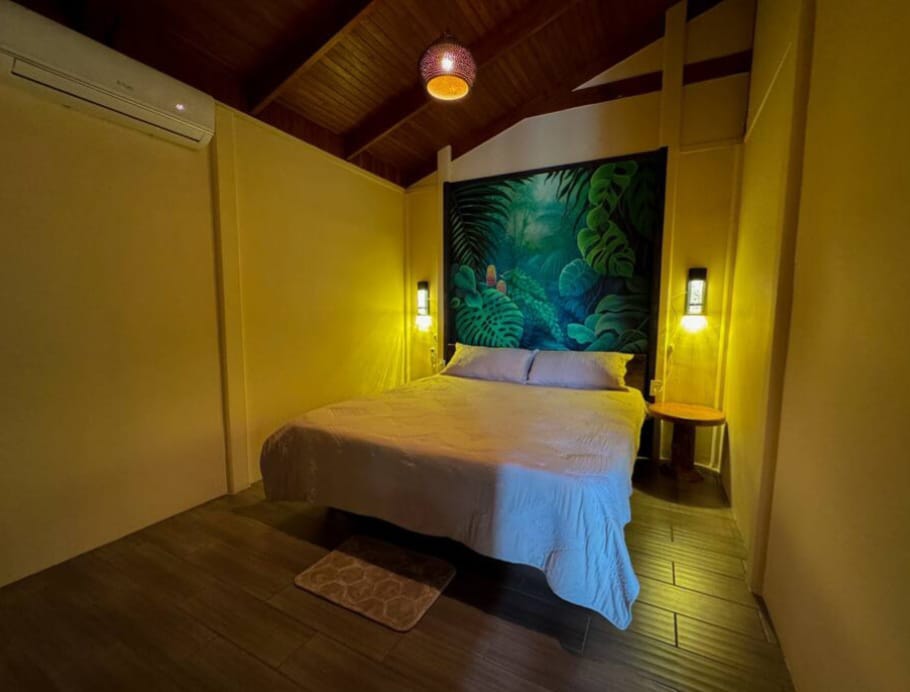 Cozy bedroom at night with warm lighting and air conditioning