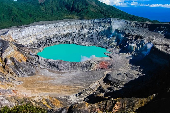 Cloud forest surrounding Poás Volcano with lush vegetation and misty atmosphere